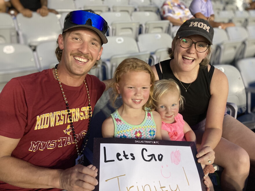 Caleb and Alex Young cheered on Dallas Trinity with their daughters, Millie and Nora.