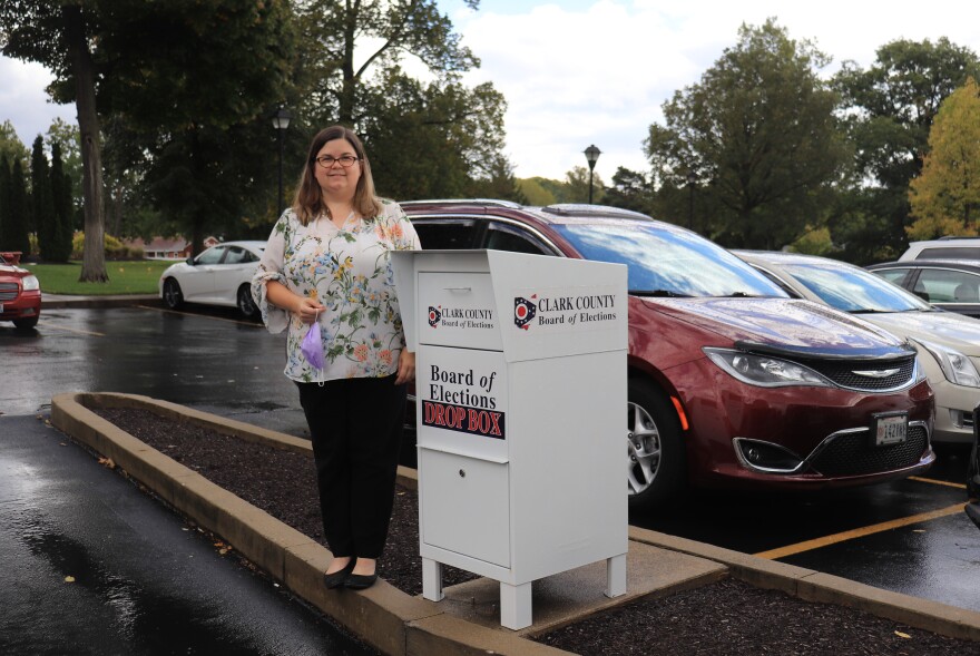 Clark County Board of Elections Deputy Director Amber Lopez next to the county's drop box.