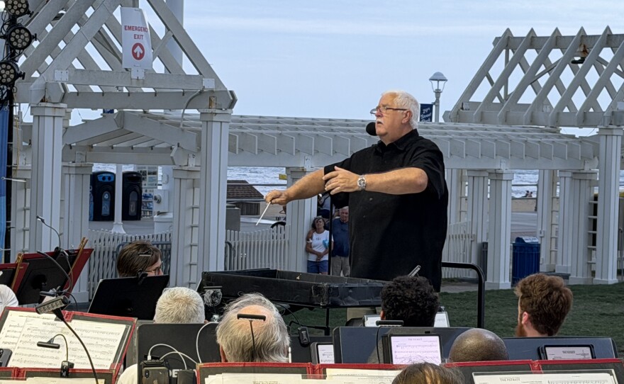 John Brewington conducting the Tidewater Winds Concert Band last month during a free concert at the Oceanfront. Brewington is the inaugural Champion for the Arts Educator for the city