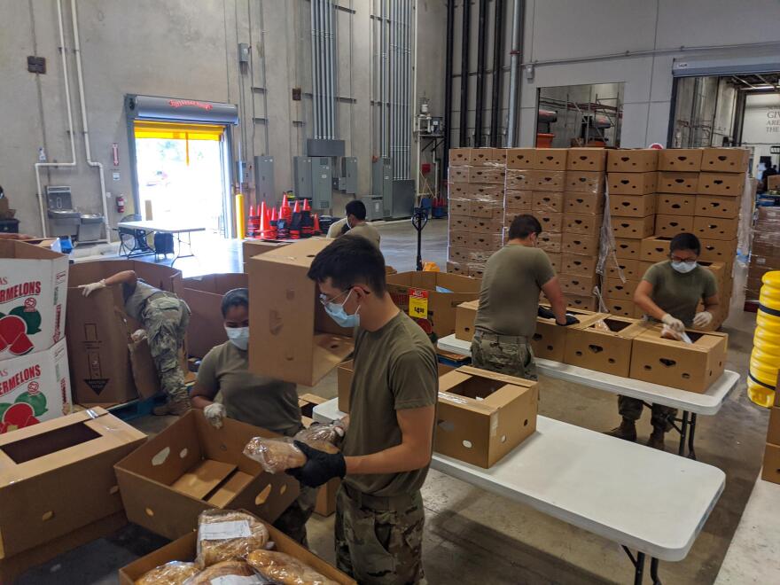 National Guard members pack baked goods. The guard work Monday through Friday at the San Antonio Food Bank.