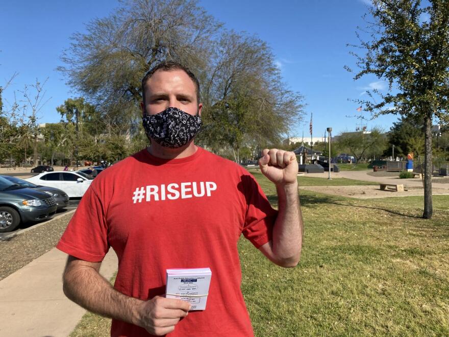 A man holds up his fist