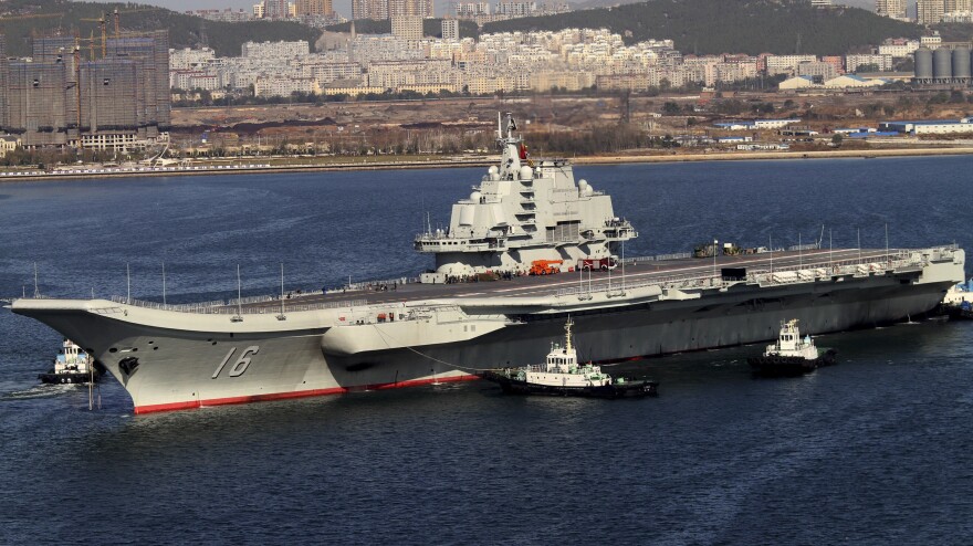The Liaoning cruises back to port Oct. 30, 2012, after its first sea trial in Dalian, China.