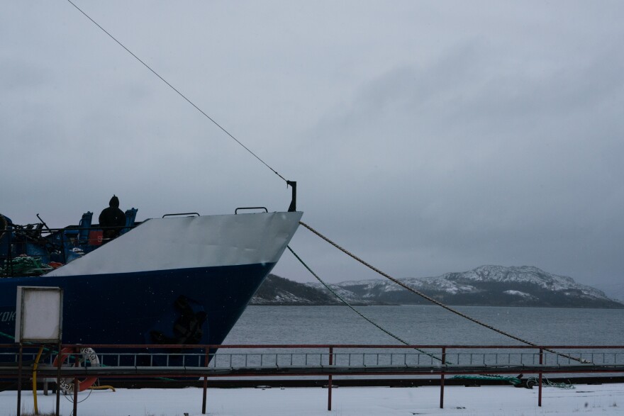 A view of a ship docked in the Kirkenes harbor.