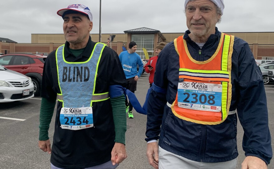 Jose Centeno and Dr. Tim Morand walk to starting line.jpg