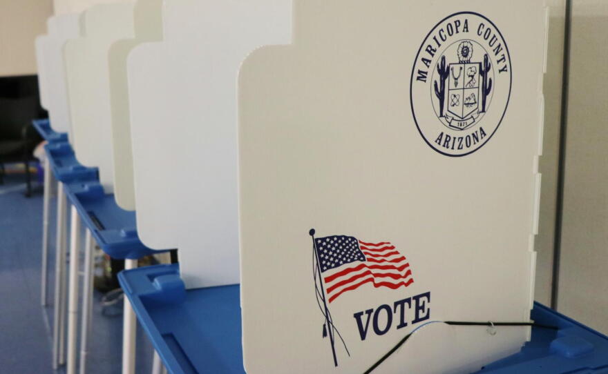 White dividers with an American flag and the Maricopa County seal on them