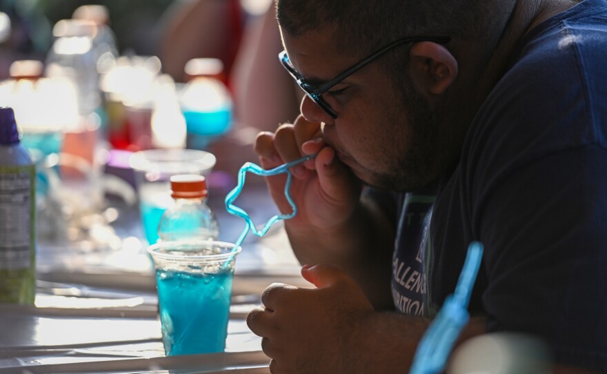 Aiden Thomas tries his patriotic drink.