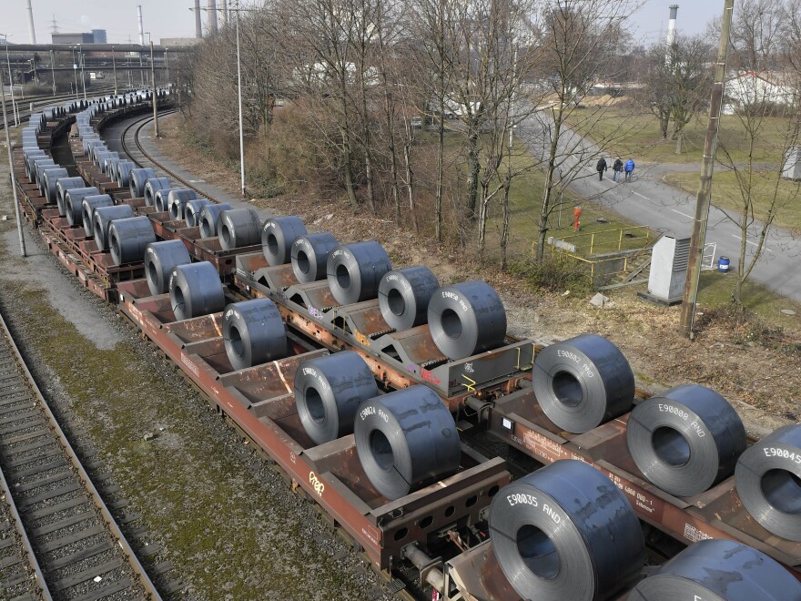 Steel coils sit on wagons leaving a factory in Duisburg, Germany on March 2. U.S. President Trump Monday decided to hold off on imposing most steel and aluminum tariffs until at least June 1.