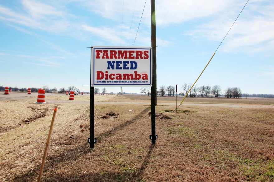 A roadside sign on a field in eastern Arkansas. Dicamba has divided farm communities. Many farmers want to continue using it, despite the risk that they might damage neighboring crops or wild trees.