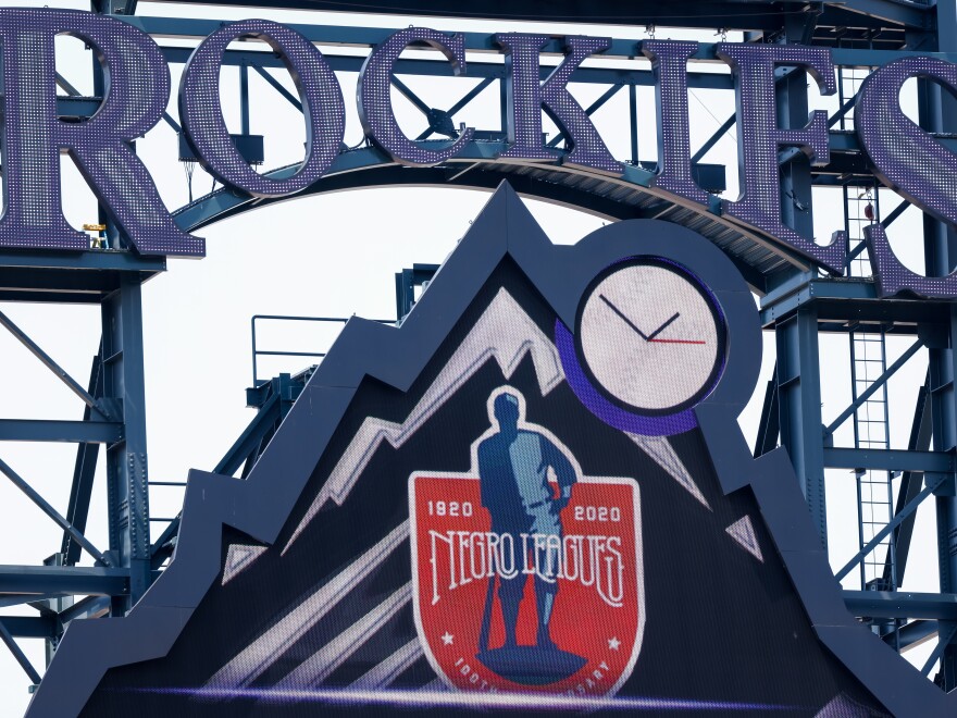 A detail of the scoreboard honoring the 100th anniversary of the Negro Leagues on display during a game between the Colorado Rockies and the Texas Rangers at Coors Field in Denver  in August.