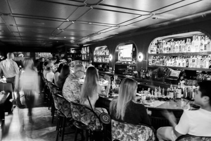 Patrons line the bar at the Clifton Club Bar & Lounge on Fitzhugh Ave.