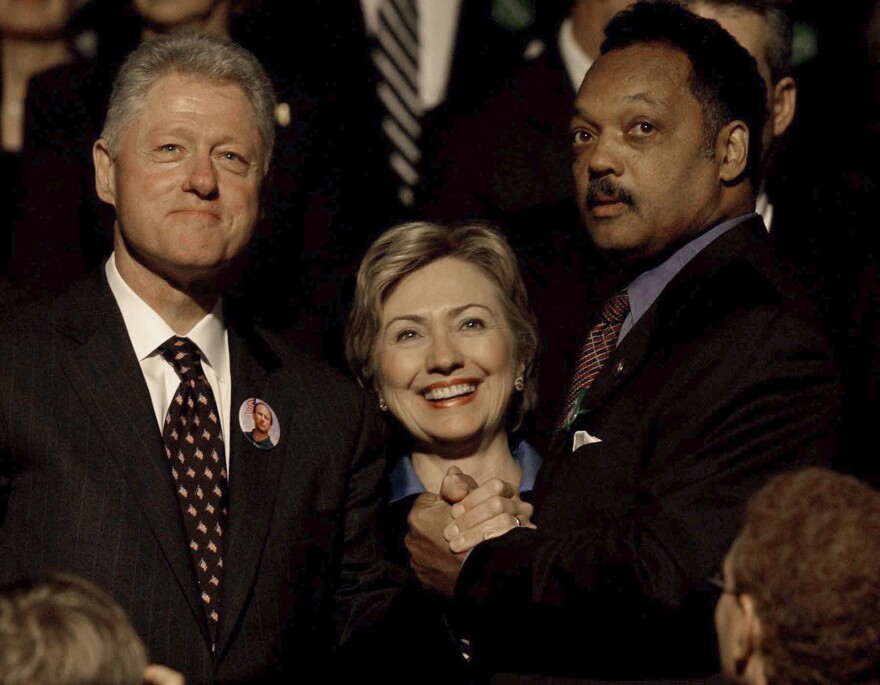 FILE - Former President Bill Clinton and his wife, U.S. Sen. Hillary Rodham Clinton, greet Jesse Jackson before a public memorial service, Oct. 29, 2002, in Minneapolis for U.S. Sen. Paul Wellstone, his wife, daughter and three staff members who died in a plane crash. (AP Photo/Stacy Wescott, Pool, File)