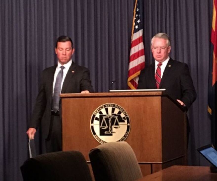 DCS Director Greg McKay and Maricopa County Attorney Bill Montgomery address the press Tuesday.