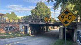 Two photos show low-clearance railroad trestles over roadways, with yellow height warning signs posted near each bridge.