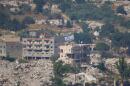An Israeli flag tops a destroyed building in southern Lebanon, as seen from northern Israel, Sunday, June 28, 2026. (Ohad Zwigenberg/AP)