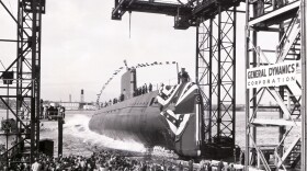 The world's first nuclear powered submarine, the U.S.S. Nautilus, enters the waters of the Thames River at her launch from the shipyard of Electric Boat Division of General Dynamics Corporation, January 21, 1954. 