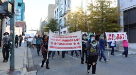 Protestors marching on College St. in downtown Asheville on Nov. 16, 2025