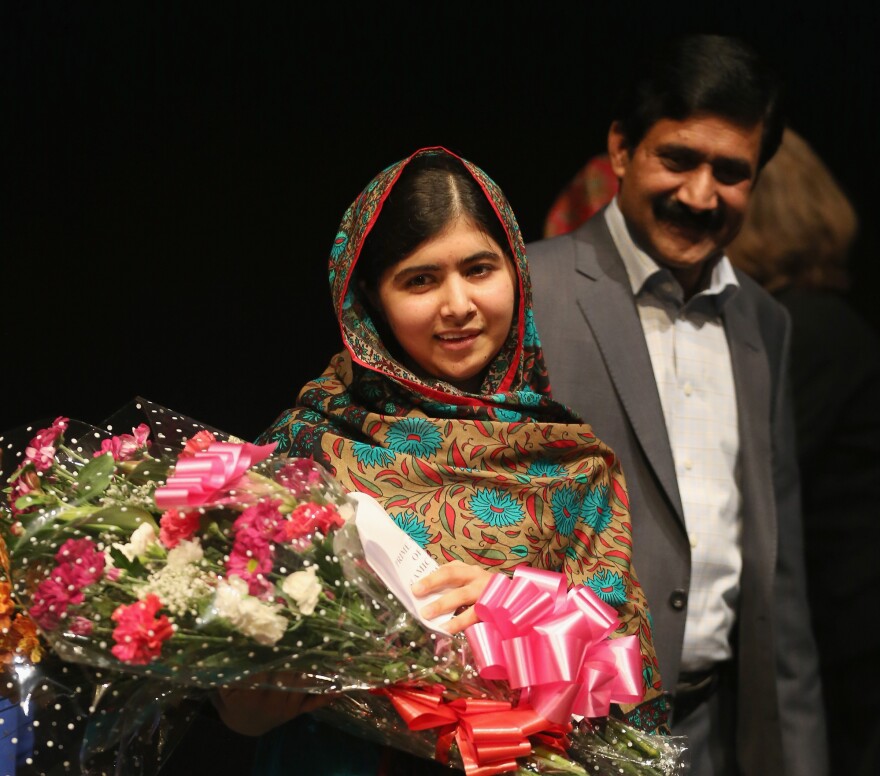 After learning that she'd won the Nobel Peace Prize, Malala Yousafzai celebrated with her father, Ziauddin Yousafzai, in Birmingham.