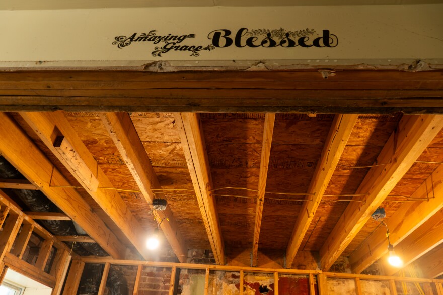 The damaged second-floor ceiling of Emma and Rahtu Stroud’s tornado-damaged home is seen on Wednesday, Sept. 10, 2025 — months after the May 16 EF3 tornado ripped off part of the roof. The couple said rain poured through the opening as they disputed repair coverage with State Farm, leaving significant damage throughout their 120-year-old Academy neighborhood house.