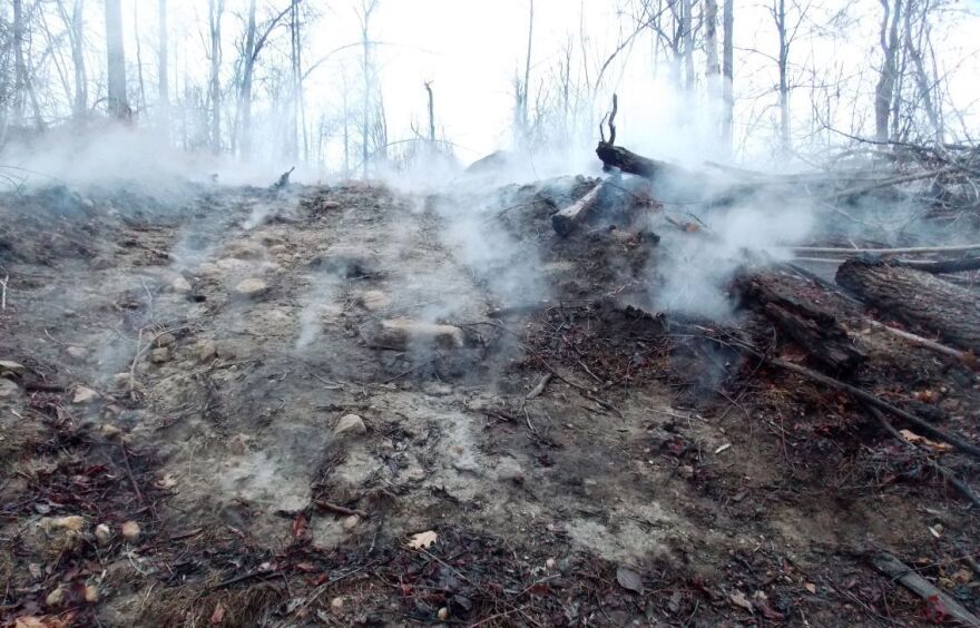Smoke billows out of the ground on a hillside in Newburg from a coal mine fire that's been burning for years.