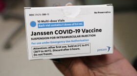 Sharis Carr, a nurse at the Aaron E. Henry Community Health Service Center in Clarksdale, Miss., holds a box containing doses of the Johnson & Johnson COVID-19 vaccine Wednesday, April 7, 2021. The U.S. is recommending a “pause” in using the single-dose Johnson & Johnson COVID-19 vaccine to investigate reports of potentially dangerous blood clots. (AP Photo/Rogelio V. Solis)