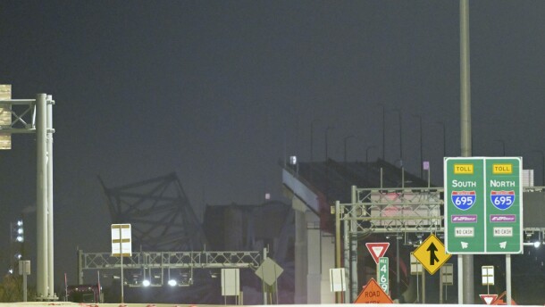 Parts of the Francis Scott Key Bridge remain after a container ship collided with a support Tuesday, March 26, 2024, in Baltimore. The major bridge in Baltimore snapped and collapsed after a container ship rammed into it early Tuesday, and several vehicles fell into the river below. Rescuers were searching for multiple people in the water. (AP Photo/Steve Ruark)