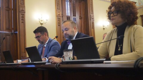 Rep. Camille Lilly, right, testifies before a House committee for passage of a bill calling for an audit of the federal 340B drug pricing program in Illinois. Also testifying were Peter Fotos, left, of Pharmaceutical Research and Manufacturers of America, and John Conrad of the Illinois Biotechnology Industry Organization.
