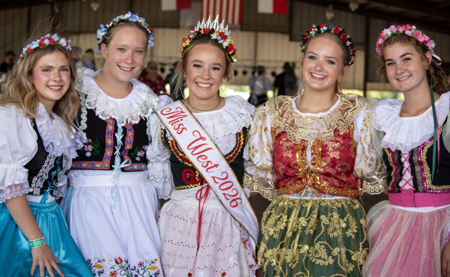 Members of West's Junior Historians, including Miss West 2026 Karen Fuessel at center, pose for a photo before their performance at the 50th anniversary of Westfest on Saturday. The performers wear kroj, a traditional Czech costume.