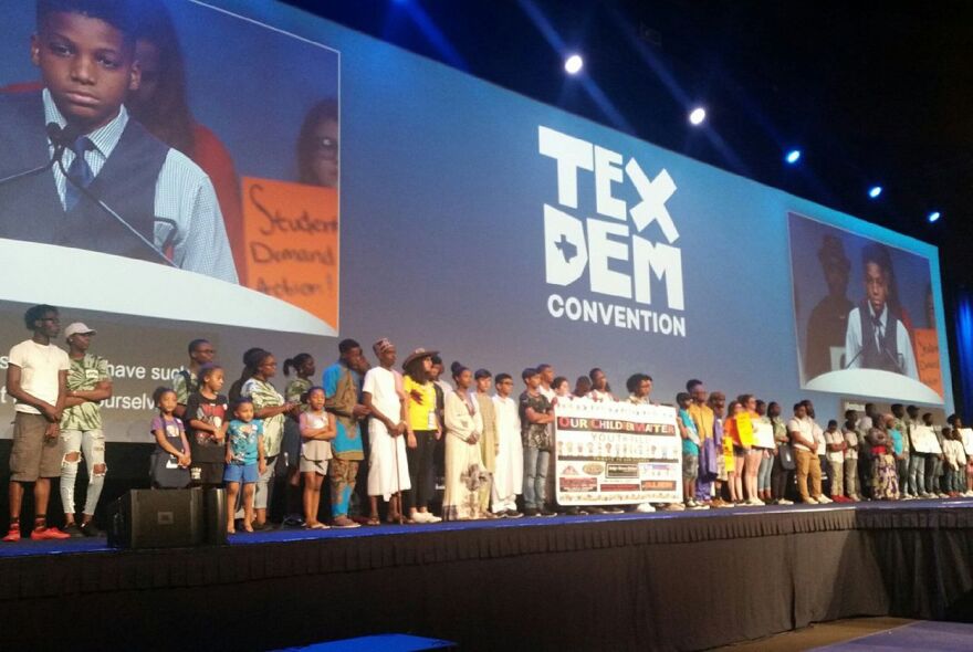 Families stand on stage during the Texas Democratic Convention in Fort Worth on Friday.