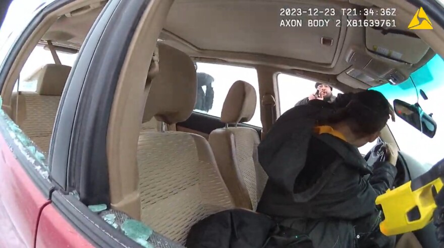 A screenshot from police body camera footage shows former Bethel police officer Jonathan Murphy draw his gun on Bernard Mael in a December 2023 incident for which Murphy was later convicted of misdemeanor assault, providing false information, and records tampering.