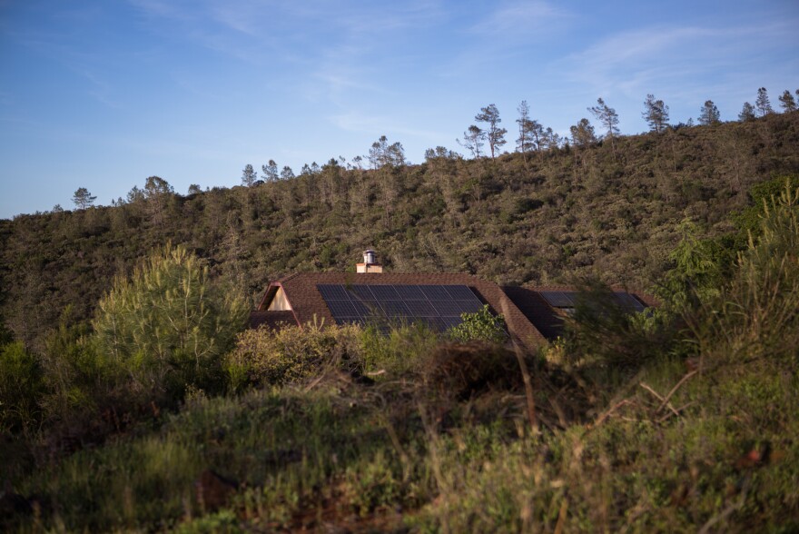 Defensible spaces, areas of cleared land around a home, act as a buffer between houses and potentially flammable vegetation.