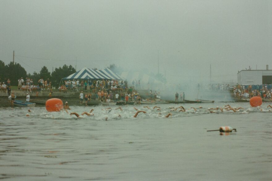 Swimmers pass the starting line in Newport. Date unknown.