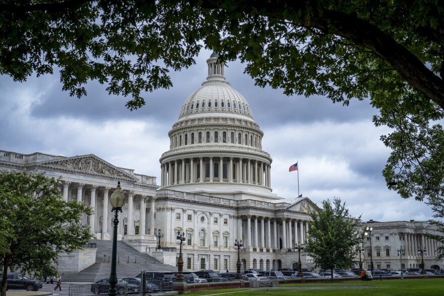 The Capitol is seen under dark skies in Washington, Tuesday, July 15, 2025.