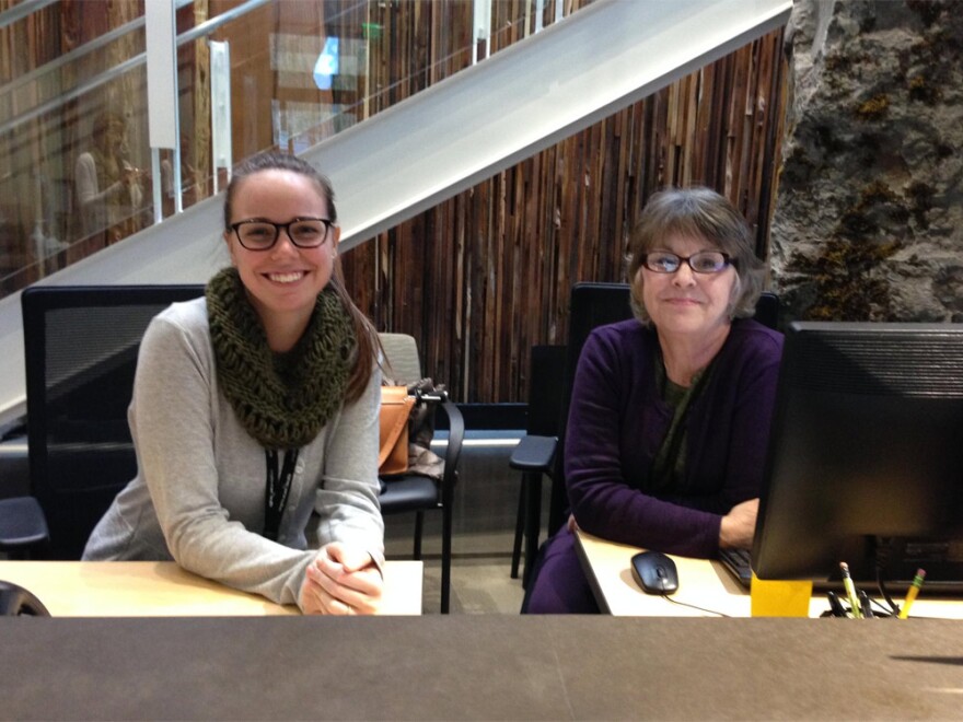 Emily Holt (left) and Kathleen Cromp staff the Welcome Desk at Meridian Center for Health. The clinic provides medical, dental, mental health and maternal support services under one roof.