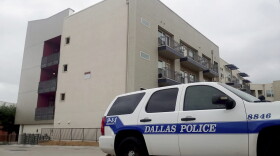 A Dallas Police vehicle is parked near the South Side Flats apartments on Monday, Sept. 10 2018 photo in Dallas. Authorities say a Dallas police officer said she shot a neighbor whose home she mistakenly entered last week after he ignored her "verbal commands." David Armstrong of the Texas Rangers wrote in an arrest affidavit released Monday that Officer Amber Guyger said she didn't realize she was in the wrong apartment until after she shot 26-year-old Botham Jean and went into the hallway to check the address. Guyger was booked Sunday on a manslaughter charge in Thursday night's killing of Jean and was released on bond. (Ryan Tarinelli/AP)