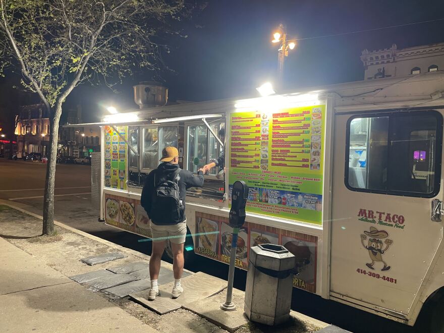 A customer picks up his order from Mr. Taco around 11 p.m. on May 6, 2026.
