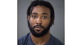 A mugshot of Malik Muhammad.