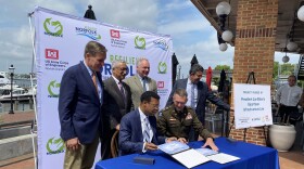 Mayor Kenny Alexander signs the Project Partnership Agreement with Col. Brian Hallberg, commander of the Army Corps of Engineers’ Norfolk District. (Photo by Katherine Hafner)