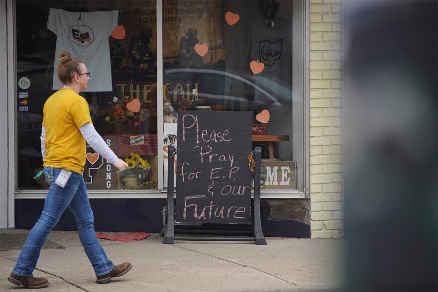 A person walks through East Palestine on Thursday, April 6, 2023.