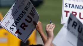Signs in support of Donald Trump's presidential candidacy during a rally in 2016. (Mark Reinstein/Getty Images)