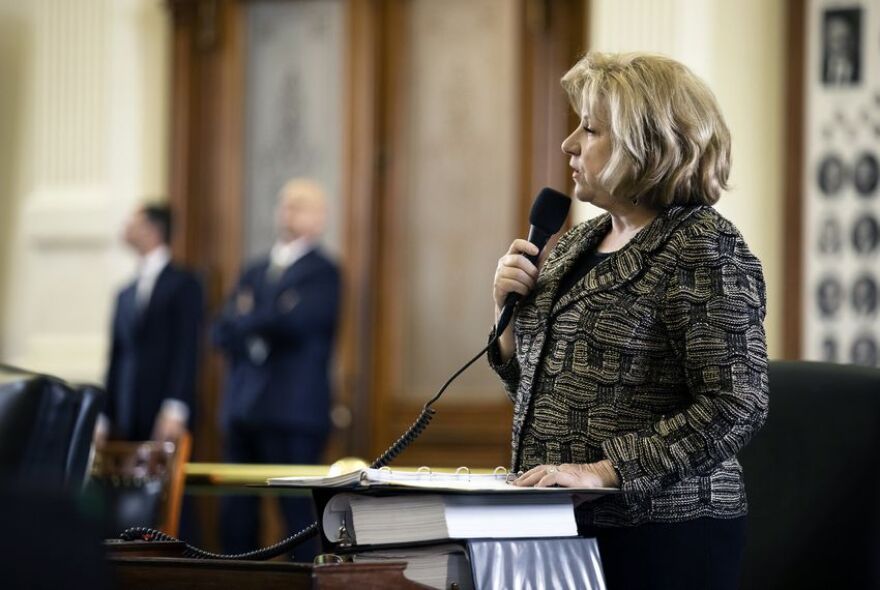 Sen. Jane Nelson, R-Flower Mound, introduces a bill to provide teachers pay raises, on the Senate floor Monday.