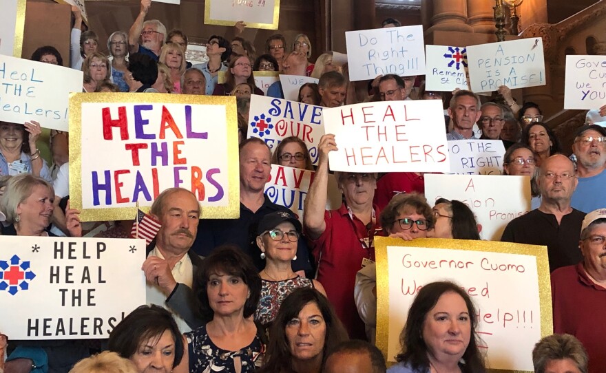 Employees of the former St. Clare's Hospital rally on the Million Dollar Staircase.