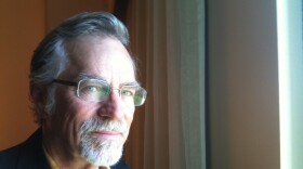 Greg Pape from the chest up, facing camera, wearing glasses.