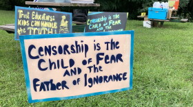 Political signs are set up in Gateway Commons Park in Winston-Salem, NC, for a barbecue hosted by Parents 4 Pub Ed. AMY DIAZ / WFDD