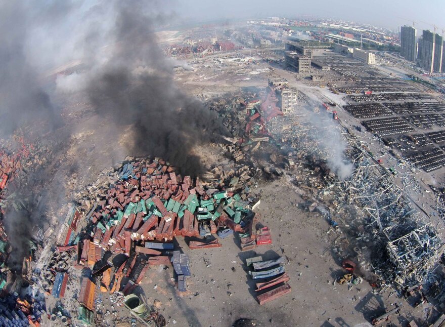 An aerial view shows the explosion site in Tianjin, north China. Dozens of people died in twin blasts Thursday.