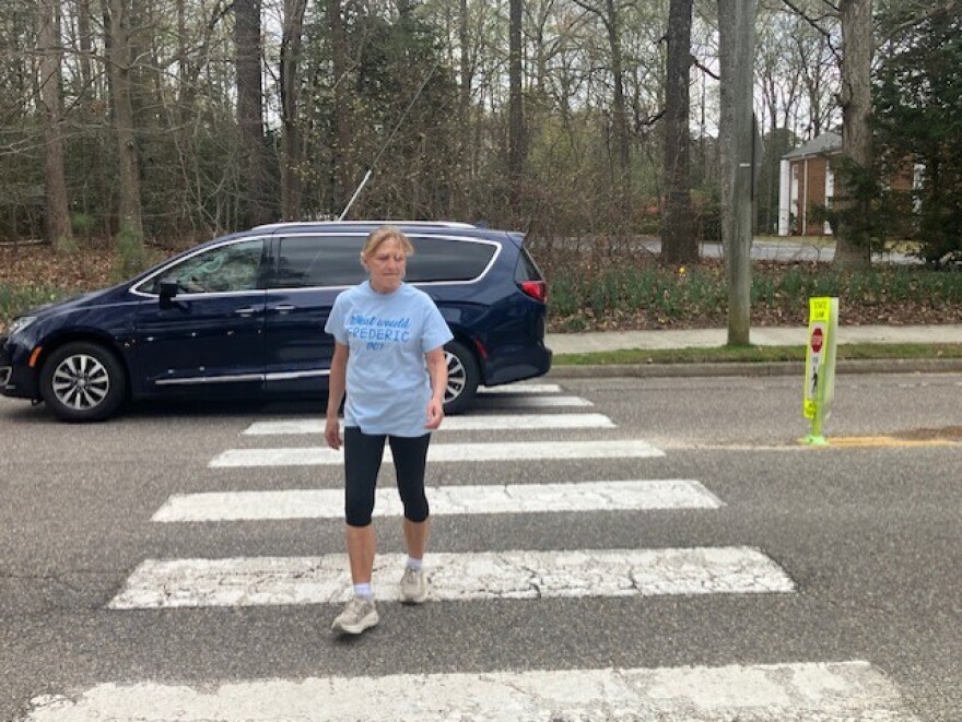 Dorothy Rounds recently crossing Longhill Road. She's one of several Williamsburg residents who lives near 