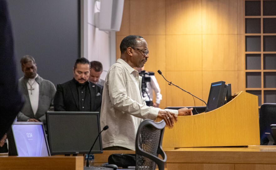 Elder Don Crowley prays for peace at the interfaith prayer service on Jan. 29. Crowley is a member of the First Church of God in Christ.