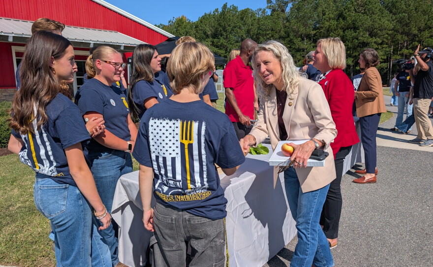 Congresswoman Jen Kiggans speaks with students in the Land Lab program as well as the Future Farmers of America program about the crops and animals they raise on the farm.