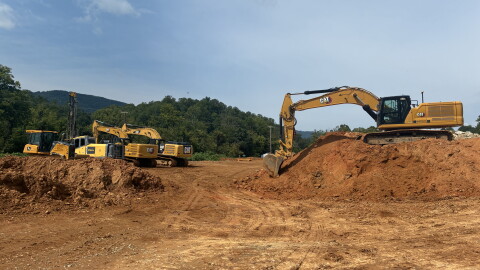 Heavy machinery on site at the former Poage Farm, as developer ABoone Real Estate and site contractor Bowman Excavating work to build 118 single-family homes.