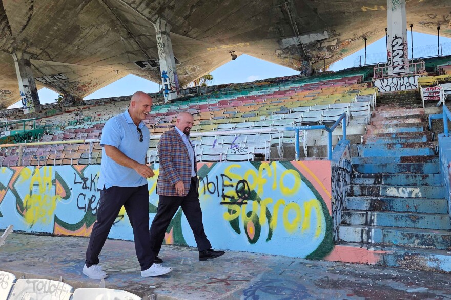 Breakwater Hospitality Group co-founder Emi Guerra, left, and Miami Commissioner Damian Pardo walk through the Miami Marine Stadium on Tuesday, Aug. 11, 2026, in Miami.