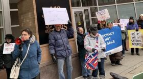 Dana Balter, left, who lost to Rep. John Katko in the 2018 election, speaks at a rally in Syracuse Thursday ELLEN ABBOTT / WRVO NEWS